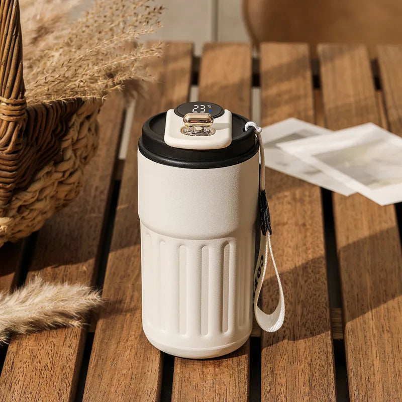 Thermos flask with temperature gauge