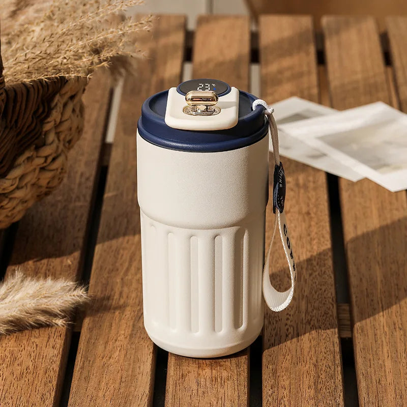 Thermos flask with temperature gauge